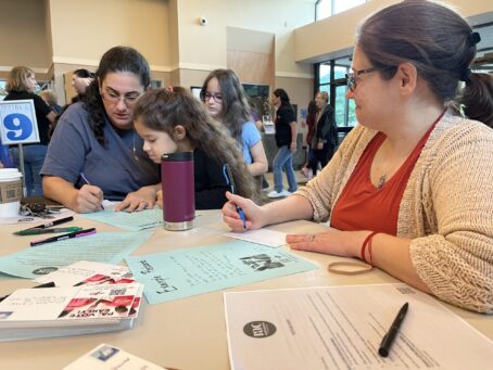 Community of Action writing the 2024 Postcard campaign.